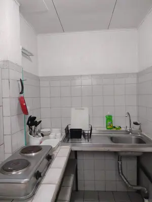 a small kitchen with a sink and a stove at Casa #4 Studios in San Pedro