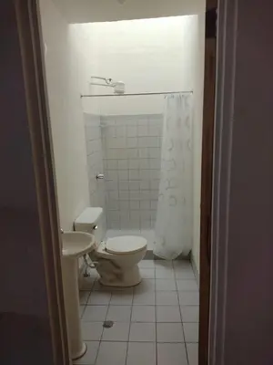 a bathroom with a toilet and a sink at Casa #4 Studios in San Pedro