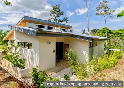 a small white house with a blue roof at Modern Villa Exclusive Tropical Nature Retreat Rio Celeste 6 to 8 Guests in Upala