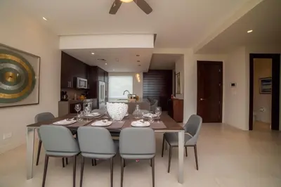 a kitchen and dining room with a table and chairs at Montecielo 3E - 3 bdr 3 1 and a half bath Ocean View in La Mona