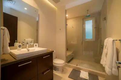 a bathroom with a sink and a shower and a toilet at Montecielo 3E - 3 bdr 3 1 and a half bath Ocean View in La Mona