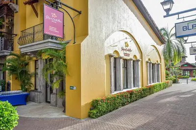 a yellow building with a sign on the side of it at Montecielo 3E - 3 bdr 3 1 and a half bath Ocean View in La Mona