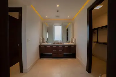 a bathroom with a sink and a large mirror at Montecielo 4A - 3 bdr 3 1 ang a half bath Ocean View in La Mona
