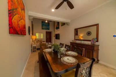 a dining room with a wooden table and a dining roomiasm at Veranda 4B - 3bdr 3bath in La Mona