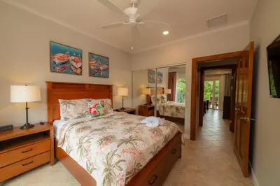 a bedroom with a bed and a ceiling fan at Veranda 4B - 3bdr 3bath in La Mona