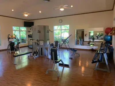 a room with a gym with exercise equipment in it at Veranda 4B - 3bdr 3bath in La Mona
