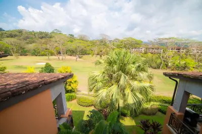 a view of the golf course from the balcony of a resort at Veranda 6C - 3 bdr 3 bath in La Mona
