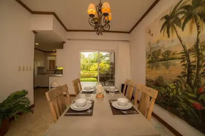 a dining room with a table and chairs at Veranda 6F - 2bdr 2 bth in La Mona
