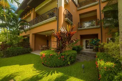 an exterior view of a building with plants and flowers at Veranda 6F - 2bdr 2 bth in La Mona