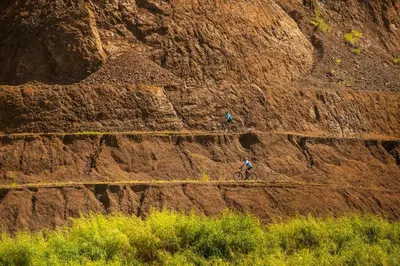 two people riding a bike on a mountain slope at Veranda 8H 3 bedr 3 bath in La Mona