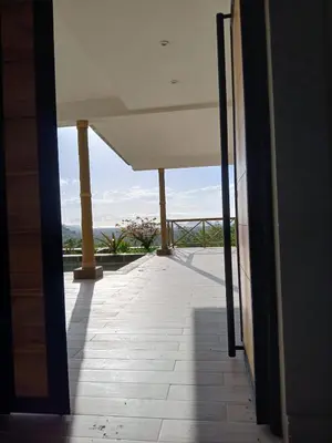 a view from the hallway of a building with a view of the ocean at Luxury villa Potrero in Potrero