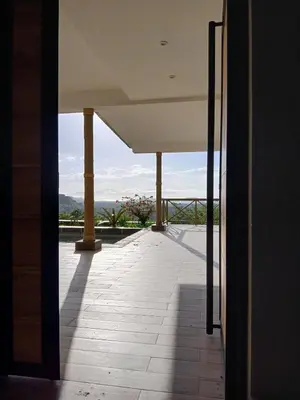 a view from the inside of a building with a balcony at Luxury villa Potrero in Potrero