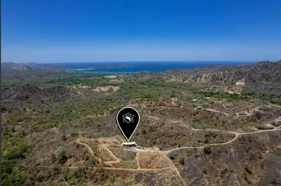 a hot air balloon flying over a mountain at Luxury villa Potrero in Potrero