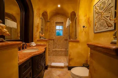 a bathroom with a toilet and a sink and a shower at Villa Angel 4 bdr Ocean View private pool Family in La Mona