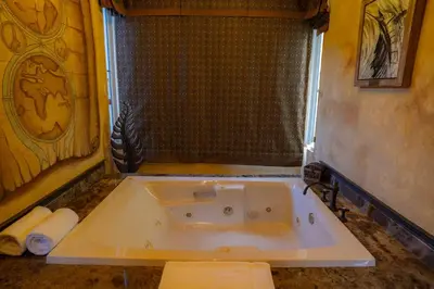 a bath tub in a bathroom with a shower at Villa Angel 4 bdr Ocean View private pool Family in La Mona