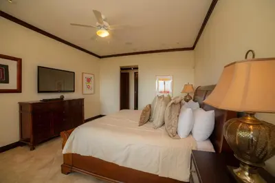 a bedroom with a bed with a ceiling fan at Altavista 2C 3 bdr 3 bath Ocean View in La Mona