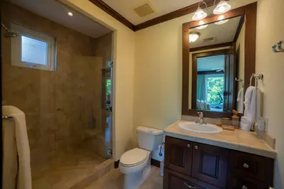 a bathroom with a toilet and a sink and a shower at Altavista 2C 3 bdr 3 bath Ocean View in La Mona