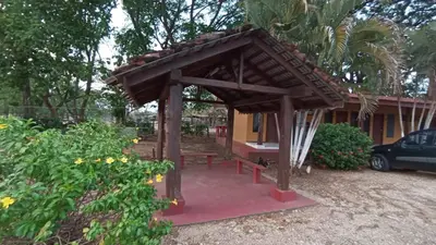 a wooden shelter in front of a house at Hotel El Paraje in Santa Cruz