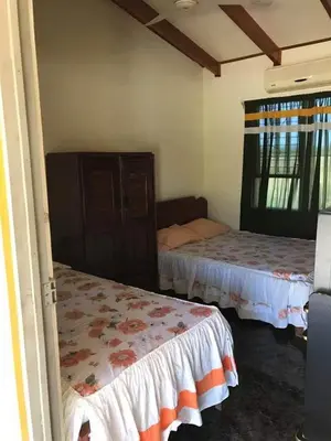 a room with two beds in a room at Hotel El Paraje in Santa Cruz