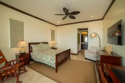 a bedroom with a bed and a ceiling fan at Altavista 5A 3 bdr 3 bath Ocean View in La Mona