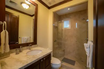 a bathroom with a shower and a sink and a toilet at Altavista 5A 3 bdr 3 bath Ocean View in La Mona