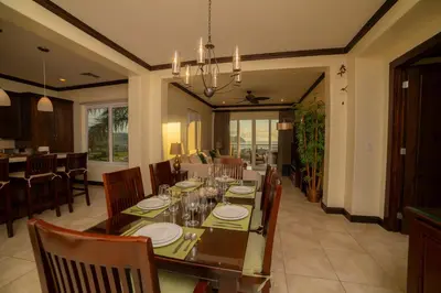 a dining room with a table and chairs at Altavista 5A 3 bdr 3 bath Ocean View in La Mona