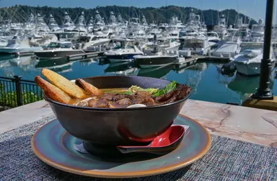 a bowl of food on a plate with a marina at Bay Residence 7C - 3 bdr 2 bath in La Mona