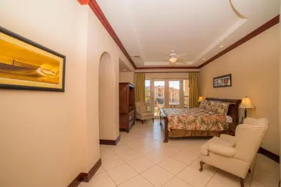 a bedroom with a bed and a table and chairs at Bella Vista 2C - 3 bdr 3 1 and a half bath in La Mona