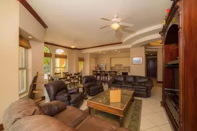 a living room with leather furniture and a table at Bella Vista 2C - 3 bdr 3 1 and a half bath in La Mona