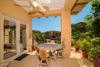 a patio with a table and chairs on a balcony at Bella Vista 2C - 3 bdr 3 1 and a half bath in La Mona
