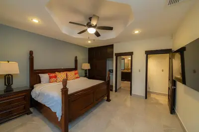 a bedroom with a bed and a ceiling fan at Casa Patron 6 bdr Private pool in La Mona