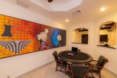 a dining room with a table and a large painting at Casa Patron 6 bdr Private pool in La Mona