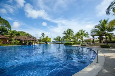 a swimming pool at a resort with palm trees at Casa Patron 6 bdr Private pool in La Mona