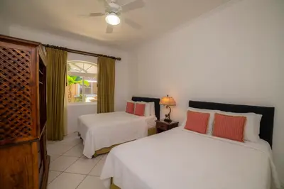 a bedroom with two beds and a window at Colina 5D - 3 bdr 2 bath Family in La Mona