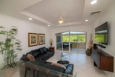 a living room with a couch and a tv at Colina 5D - 3 bdr 2 bath Family in La Mona