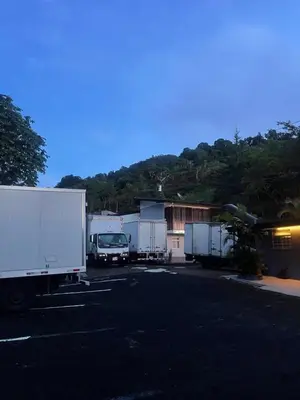a group of trucks parked in a parking lot at Donguis Rooms in San Pablo