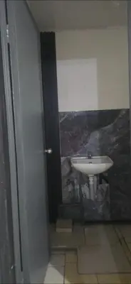 a bathroom with a white sink in a room at Rohrmoser a 100 metros de la embajada americana in San José
