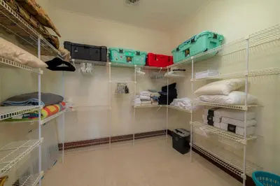 a walk in closet with white shelving at Bella Vista 3A 3BR Ocean View in La Mona