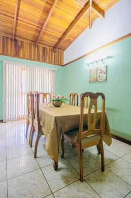 a dining room with a table and chairs at Family Nest Turrialba in Turrialba