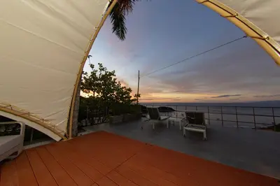 a view of a deck with chairs and a tent at A Slice of Paradise in Sardinal