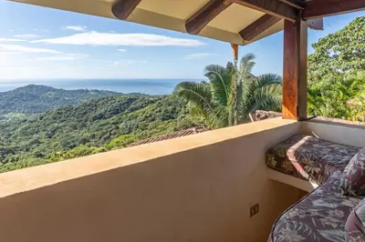 a balcony with a view of the ocean at Casa Sonora - Ocean View in Carrillo