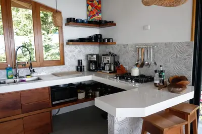 a kitchen with a sink and a counter top at Casa Selvática Wildlife-Happiness in Uvita