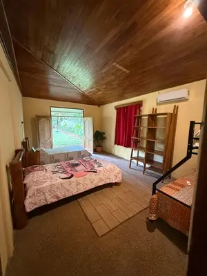 a bedroom with a large bed in a room at Casa Terracota in Bejuco