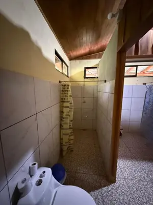 a bathroom with a toilet and a sink at Casa Terracota in Bejuco