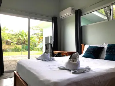 a bedroom with two stuffed animals sitting on a bed at Screened-In Porch! Short Walk To Beach! in Sámara