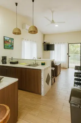 a large kitchen with a sink and a counter at Casa Sol in Santa Rita