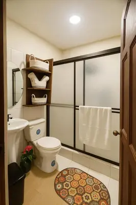 a bathroom with a toilet and a sink at Casa Sol in Santa Rita