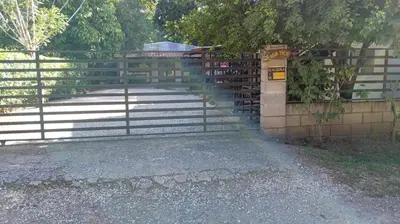 a gate with steps and a fence with a fence at CASA TICA Apart 1 y 2 in Potrero