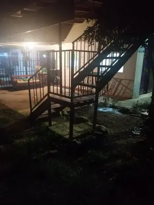a staircase in front of a building at night at CASA TICA Apart 1 y 2 in Potrero