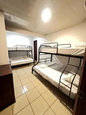 a room with three bunk beds in it at Casa Lapas in Guayabal